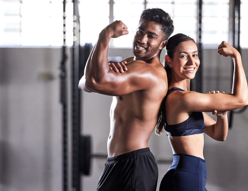 fitness-flexing-muscles-and-strong-couple-goals-w-2026-01-09-10-20-48-utc Fitness, flexing muscles and strong couple goals while doing exercise or training in a gym. Portrai.